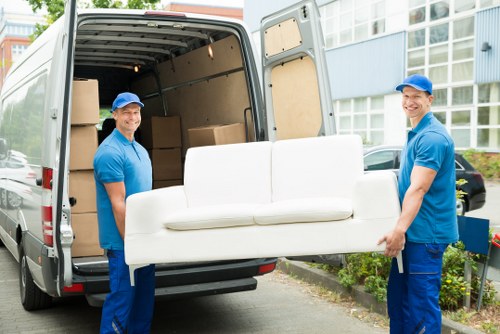 Moving van beside elegant Kensington townhouses