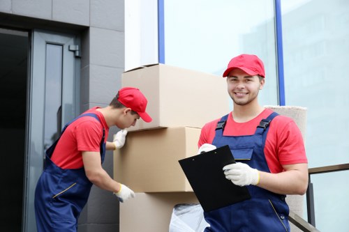 Removal team planning a safe move with boxes and protective equipment
