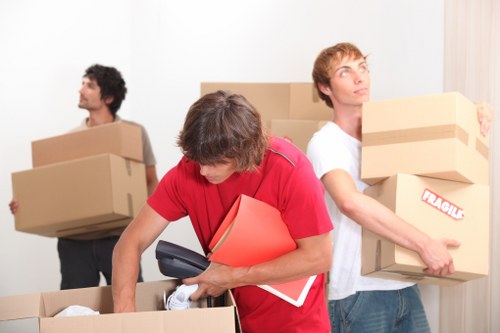 Packed office furniture and equipment ready for relocation in Kensington