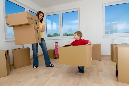 Local Kensington removals team handling furniture and boxes in a residential area