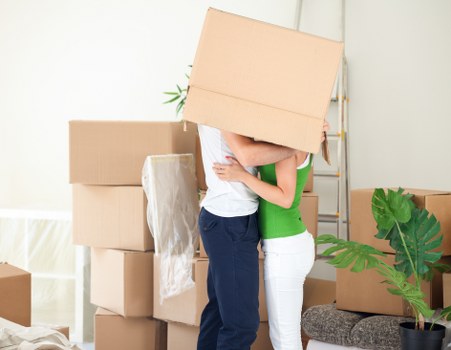 Staff protecting floors and doorways during a move