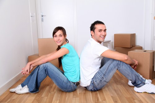 Movers handling stairs and access in a Kensington property