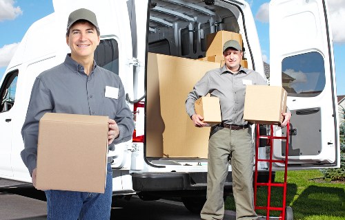 Packed moving boxes and furniture protection for a Kensington relocation