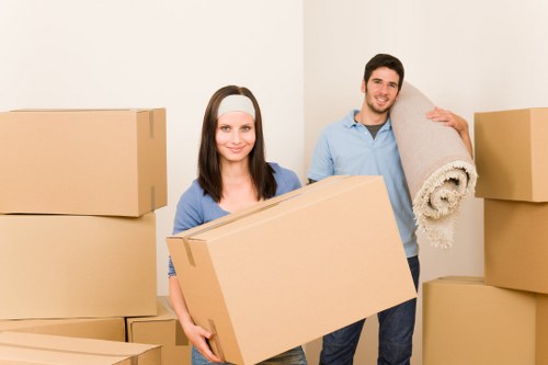 Removal company staff handling items with care in Kensington