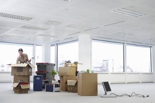 Professional movers transporting household items in Kensington
